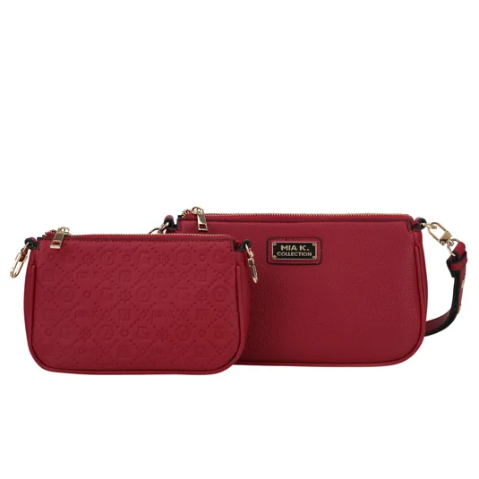 Two red handbags from MIA K. Collection, featuring gold-tone zippers and hardware. The smaller bag has a textured pattern, while the larger bag has a smooth finish with a logo plaque.