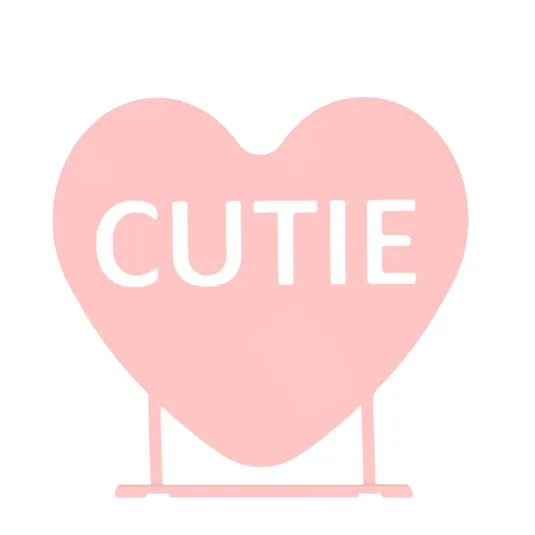 A pink heart-shaped sign featuring the word \“CUTIE.\“