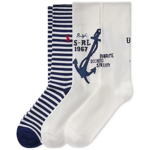 Three pairs of socks: one striped navy and white with a small red emblem, one white with an anchor and text design, and one plain white with text.