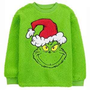 This is a bright green, fuzzy pullover featuring a large graphic of the Grinch wearing a Santa hat on the front.