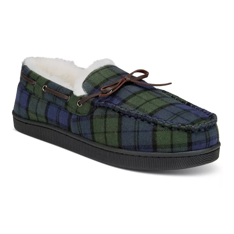 Club Room Moccasin Slippers feature a green and blue plaid pattern with a soft, fluffy interior and brown leather laces. They have a black rubber sole, providing comfort and style for indoor wear.