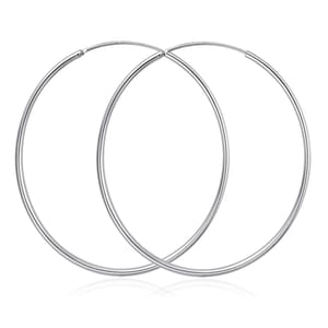 Two simple and sleek 65mm silver hoop earrings with a smooth finish and a thin, circular design for a minimalist and elegant look.