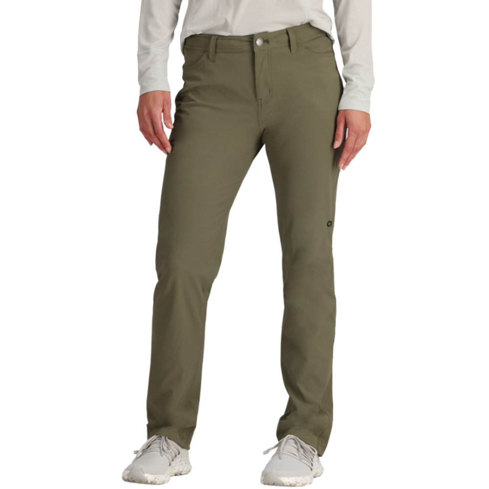 A person is wearing olive green pants, paired with a white long-sleeve shirt and light gray sneakers.