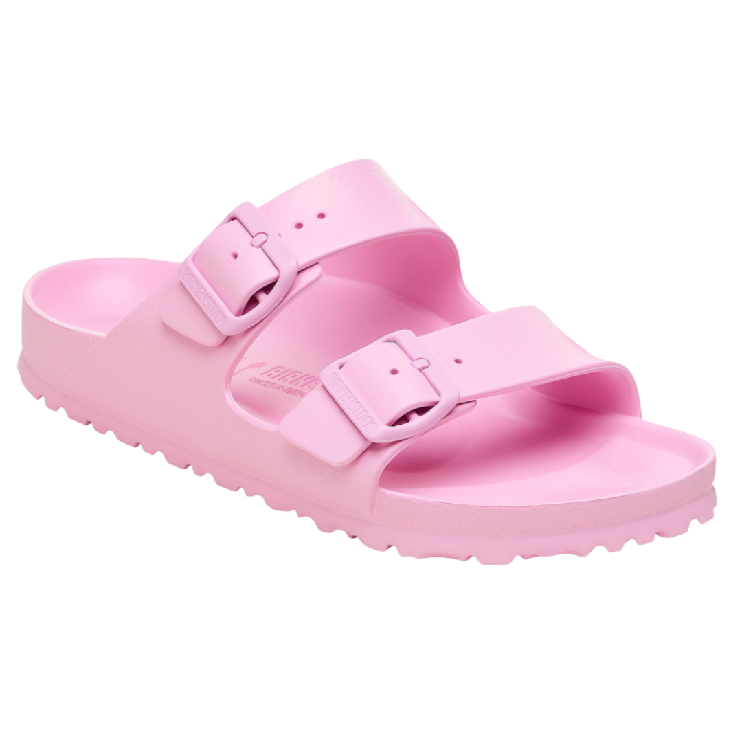 A pink sandal with two adjustable straps and buckles, featuring a contoured footbed and textured sole.
