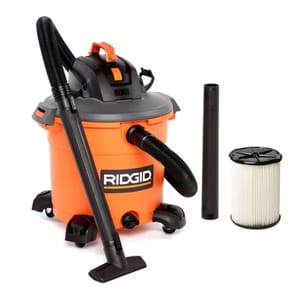 RIDGID wet/dry shop vacuum with an orange canister, black top, flexible hose, wide nozzle, extension wand, and cylindrical filter.