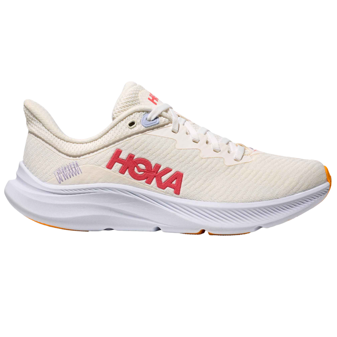 Cream-colored HOKA running shoe with red branding, featuring a thick sole and minimalistic design.