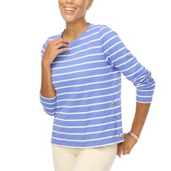 A long-sleeve top with blue and white horizontal stripes features side buttons and a crew neckline. The top pairs well with light-colored pants and is accessorized with a silver bangle.