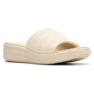 Cream-colored slide sandal with a textured, perforated strap and a thick, wavy sole for comfort.