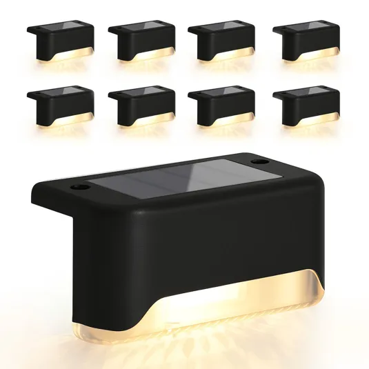 Black solar-powered LED step lights with a sleek design, emitting a warm glow, arranged in a set of eight.