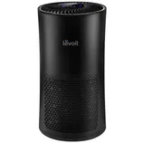 A black Levoit air purifier featuring a cylindrical design with a digital control panel on top and a perforated pattern on the front for air intake.