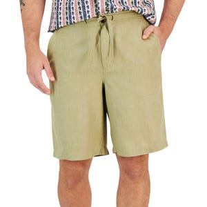 Light olive green linen shorts with side pockets and a drawstring waist, paired with a patterned shirt.