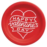 Red paper plate with white text that reads \“Happy Valentine's Day,\“ featuring a heart and ribbon design.