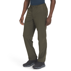 Man wearing olive green pants and black hiking shoes.