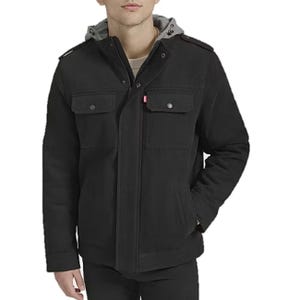 Levi's Military Hooded Work Jacket is a black, mid-length coat with a gray hood. It features a front zipper and button closure, two flap chest pockets, and side pockets. The design is casual yet structured, suitable for various weather conditions.