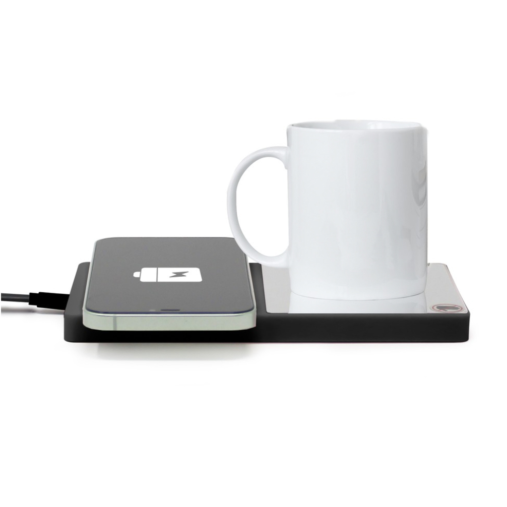 A wireless phone charging pad and a mug warmer with a white mug placed on it.