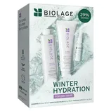Biolage Winter Hydration set for dry hair includes Hydra Source shampoo (13.5 fl. oz./400 ml), conditioning balm (8.0 fl. oz./236 ml), and repairing spray (1.0 fl. oz./30 ml). Features 100% recycled plastic and vegan formula.