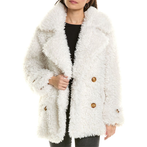 The Free People Sophie Peacoat is a textured, double-breasted coat with large lapels, crafted from fluffy, white material. It features brown buttons and a relaxed fit, providing a cozy and stylish look for colder weather.