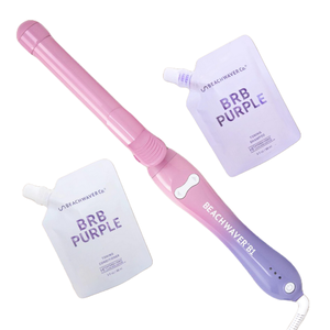 The 3pc Beachwaver Pink Sunset includes a pink and purple curling iron and two pouches of BRB Purple toning shampoo and conditioner from Beachwaver Co.