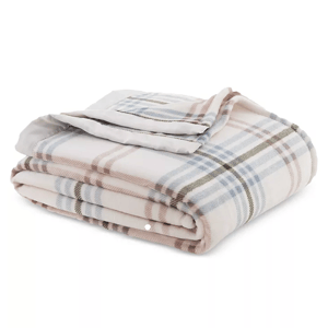 A folded plaid blanket with pastel pink, blue, and cream colors.