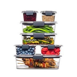 Stacked clear plastic containers with black latches, filled with various foods including vegetables, fruits, grains, and cooked meat.