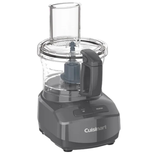 Cuisinart food processor with a transparent bowl and lid, featuring a feed tube and a handle on the side.