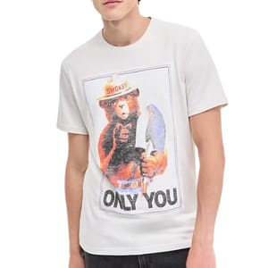A person is wearing a white T-shirt featuring Smokey Bear holding a shovel with the text \“ONLY YOU.\“