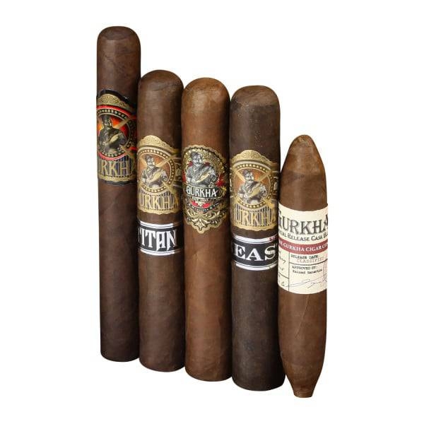 The 5-Cigar Gurkha Sampler includes five cigars with distinct labels: two with intricate designs and logos, one labeled \“TITAN,\“ another labeled \“BEAST,\“ and a uniquely shaped cigar labeled with white and red text.