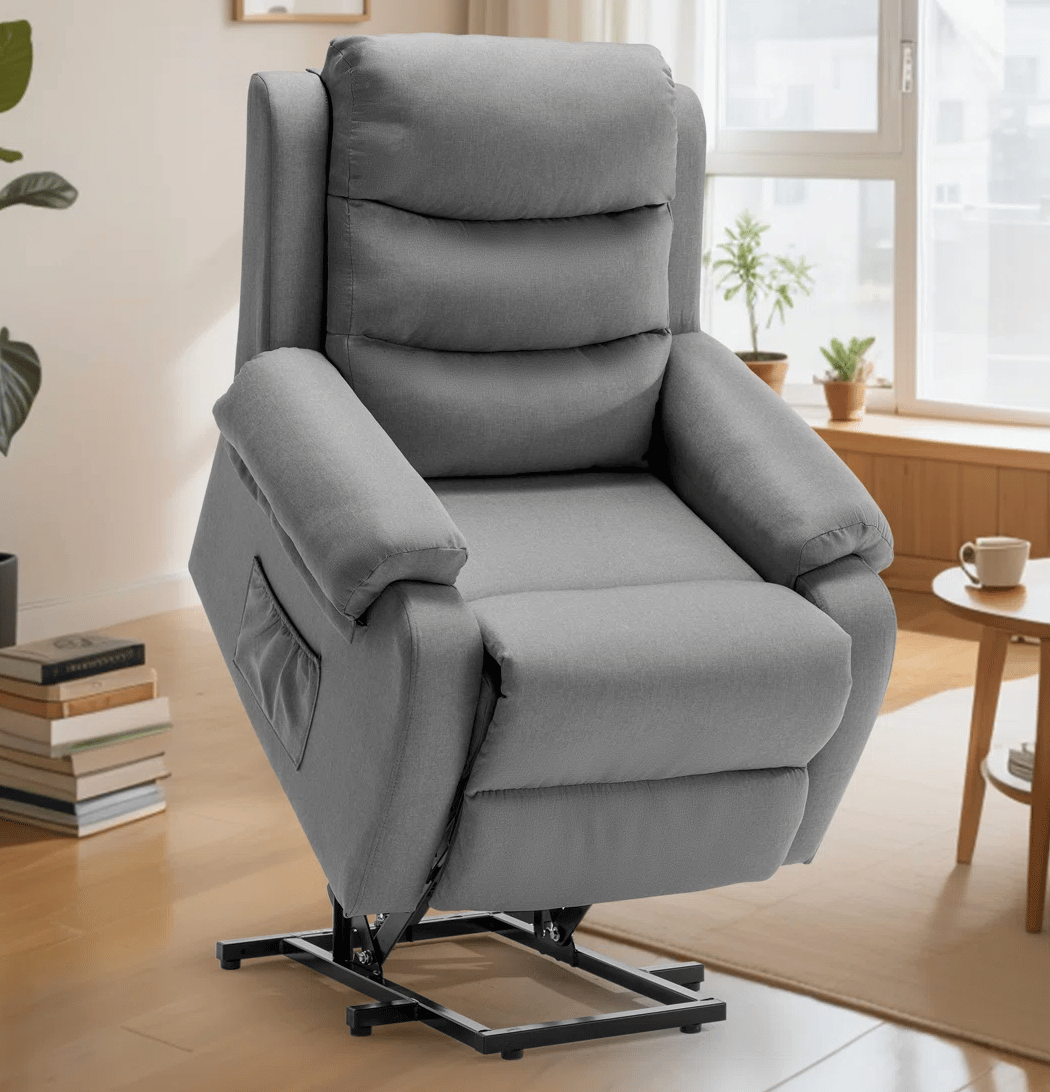 A gray reclining chair with a built-in lift mechanism, designed for assistance in standing up, features a pocket on the side and is set in a modern living room environment.
