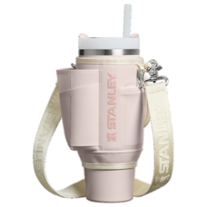 The Stanley 30oz Quencher Carry-All in a soft pink hue features a structured body with a strap for easy carrying, a pocket for small items, and a straw for convenient drinking.