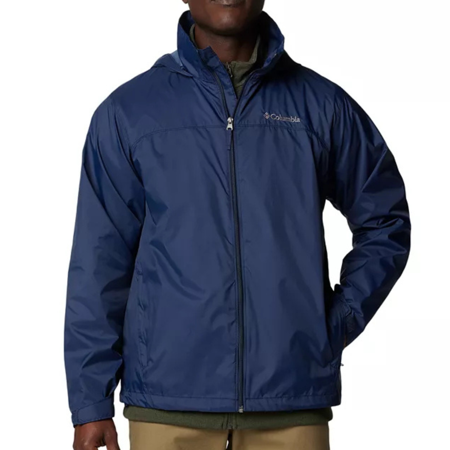 A man is wearing a navy blue Columbia zip-up jacket with an attached hood and side pockets.