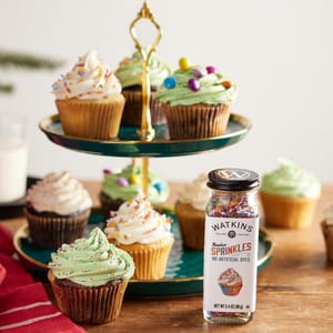 Watkins Dye-Free Rainbow Sprinkles come in a 3.4 oz (98 g) bottle and feature colorful sprinkles without artificial dyes, suitable for decorating baked goods like cupcakes.