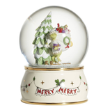 A snow globe depicting a green character with a Christmas tree and sack of gifts, on a base with \“Merry Merry\“ text and decoration.