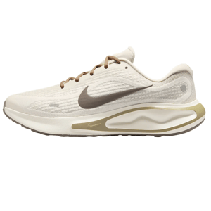 Nike Men's Journey Run Shoes feature a sleek, lightweight design with a beige upper, brown laces, and a brown Swoosh logo. They have a cushioned midsole for comfort and a stylish, modern aesthetic.