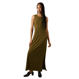 Sleeveless, olive green maxi dress with a side slit, worn with black, low-heeled slip-on shoes.