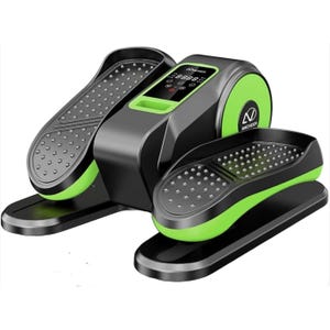 An under-desk elliptical machine with a sleek design, featuring black and green colors, textured foot pedals, and a digital display.