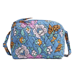 Vera Bradley Camera Bag Crossbody in blue features a quilted floral pattern in pink, orange, and green with an adjustable strap.