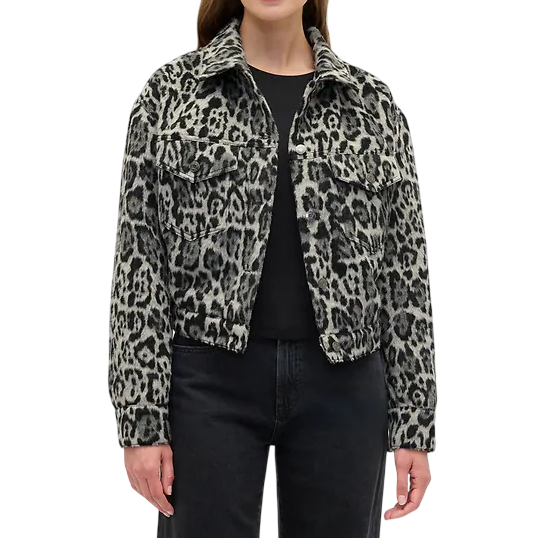 A woman wears a black and gray leopard print jacket with front pockets and a collar. The style is casual, paired with a black shirt and dark jeans.