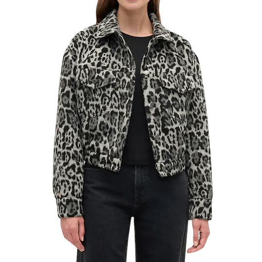 A woman wears a black and gray leopard print jacket with front pockets and a collar. The style is casual, paired with a black shirt and dark jeans.