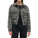 A woman wears a black and gray leopard print jacket with front pockets and a collar. The style is casual, paired with a black shirt and dark jeans.