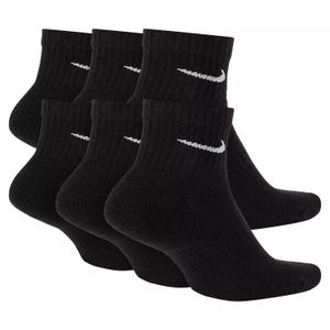 A set of black ankle socks with a white swoosh logo.