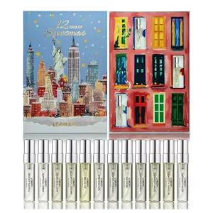 12-piece perfume sampler set with each vial labeled with a different fragrance, displayed in a 12-day advent calendar theme box featuring a New York City skyline and colorful painted doors.