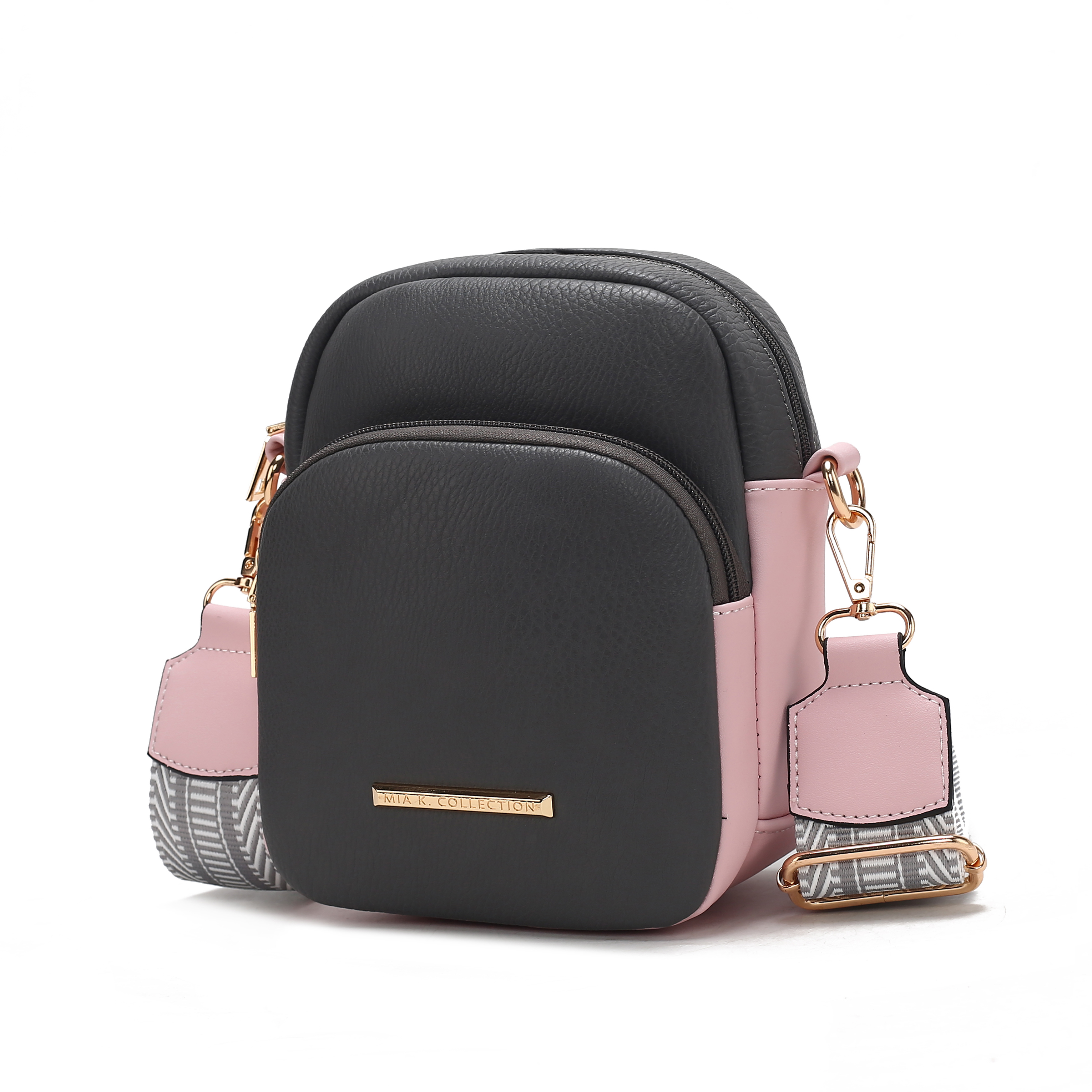 Black leather backpack with pink accents and decorative keychain.