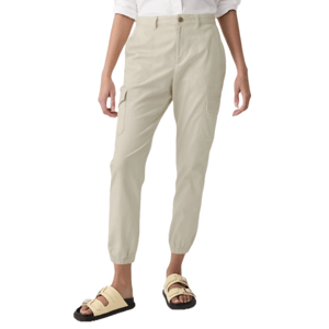 Light khaki cargo joggers with a relaxed fit, cuffed ankles, side pockets, and sandals. They sit at mid-waist and have a button-front closure.