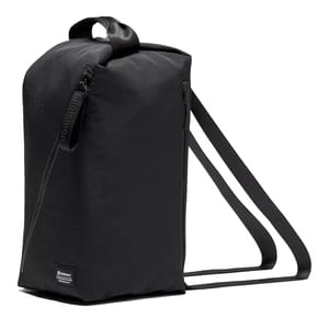 A black rectangular backpack with side zippers and dual shoulder straps, featuring a top handle. Brand label visible at the bottom corner.