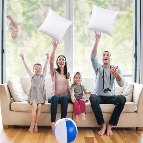 A family of four enjoys tossing white pillows and a beach ball, captured in a cheerful living room setting.
