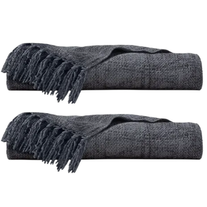 Two folded dark gray woven throws with fringe detailing.