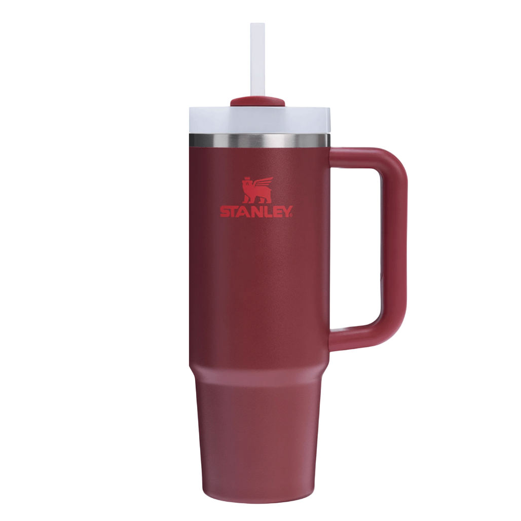 A red Stanley insulated tumbler featuring a handle and straw.