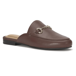 A brown leather mule slipper featuring a classic loafer design with metallic hardware across the front, and a flat heel suitable for casual wear.