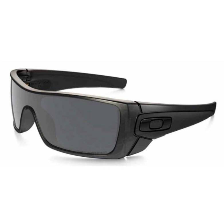 Oakley Batwolf sunglasses feature a single lens shield design with black frames and polarized dark gray lenses for glare reduction. The temples have an interchangeable icon for customization.