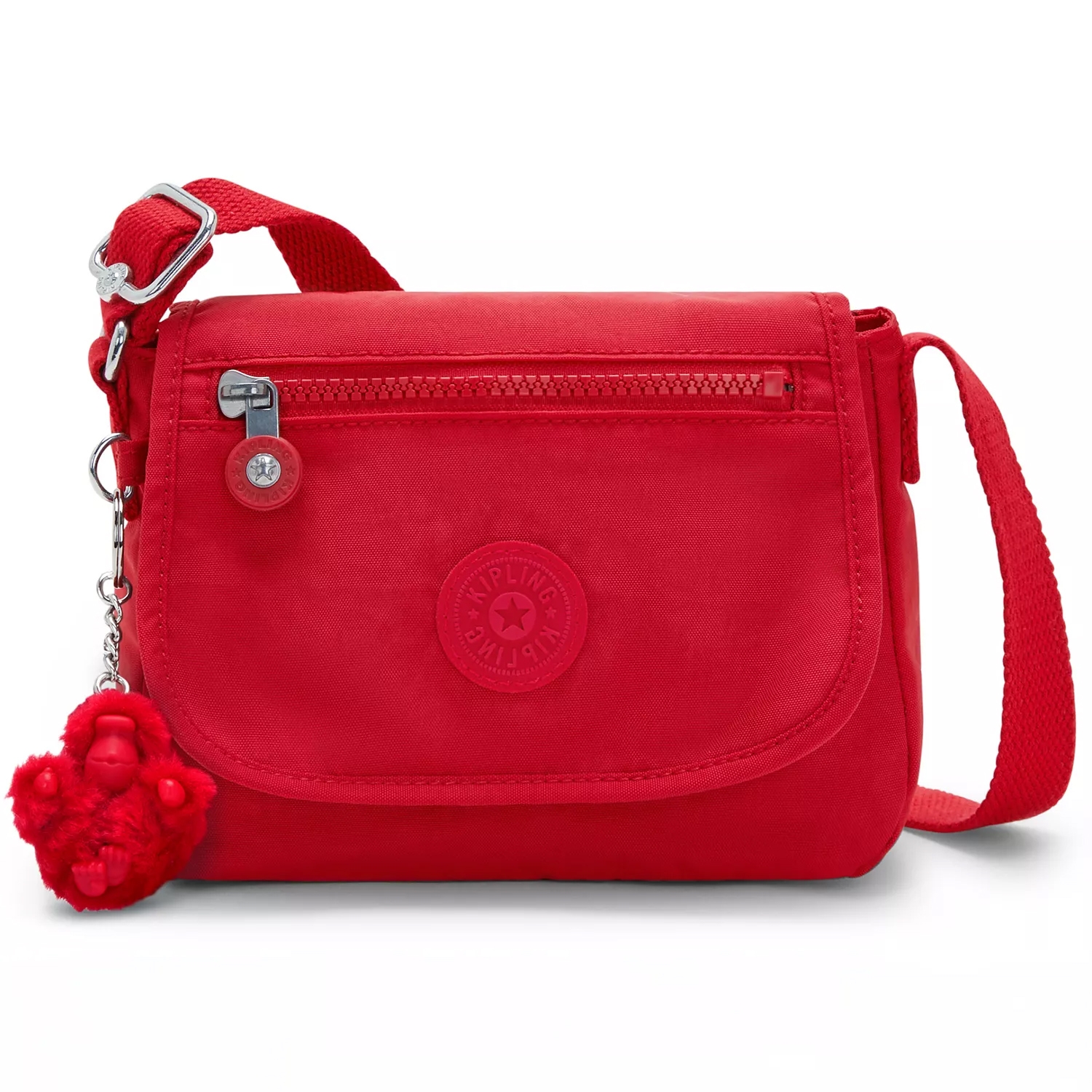 A red Kipling crossbody bag with a zippered front pocket, adjustable strap, and attached fuzzy keychain charm.